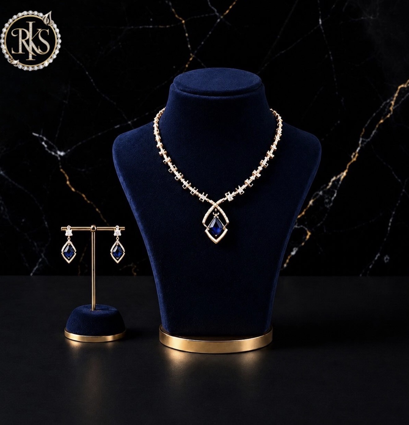 Blue-stone and diamond necklace with matching earrings on navy bust — Ramesh Kapoor & Sons Jewellers